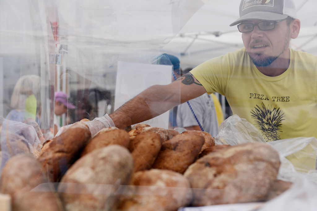 Chris Foley restocks his bread display